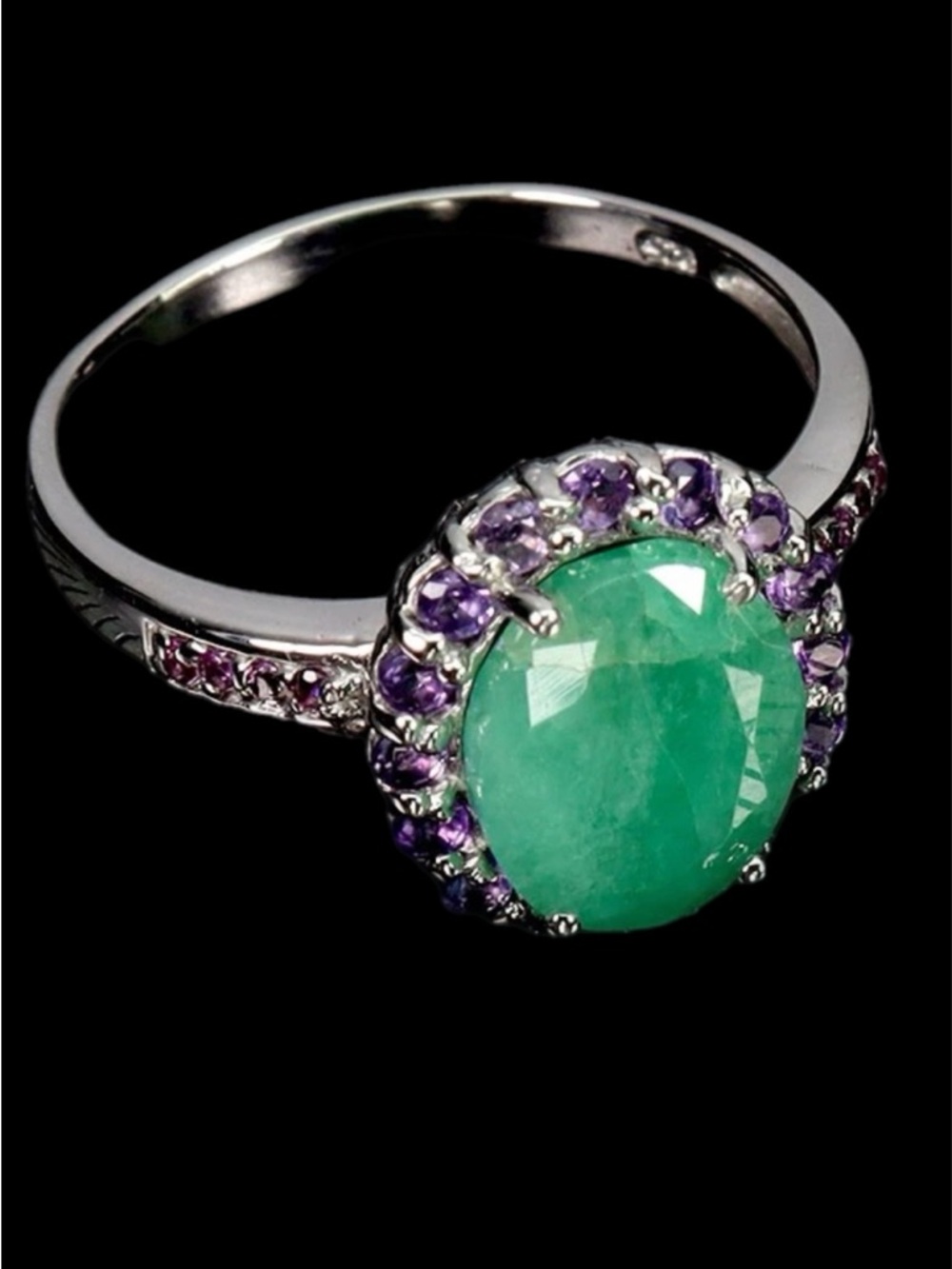 Genuine 8 mm by 10mm Emerald- Halo Ring with Genuine Amethysts
See Video - Picture 3 of 7